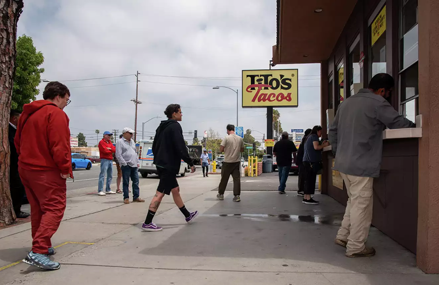 Customers ordering food at Tito's Tacos